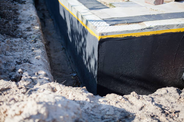 Professional Waterproofing technician working in Covington, IN